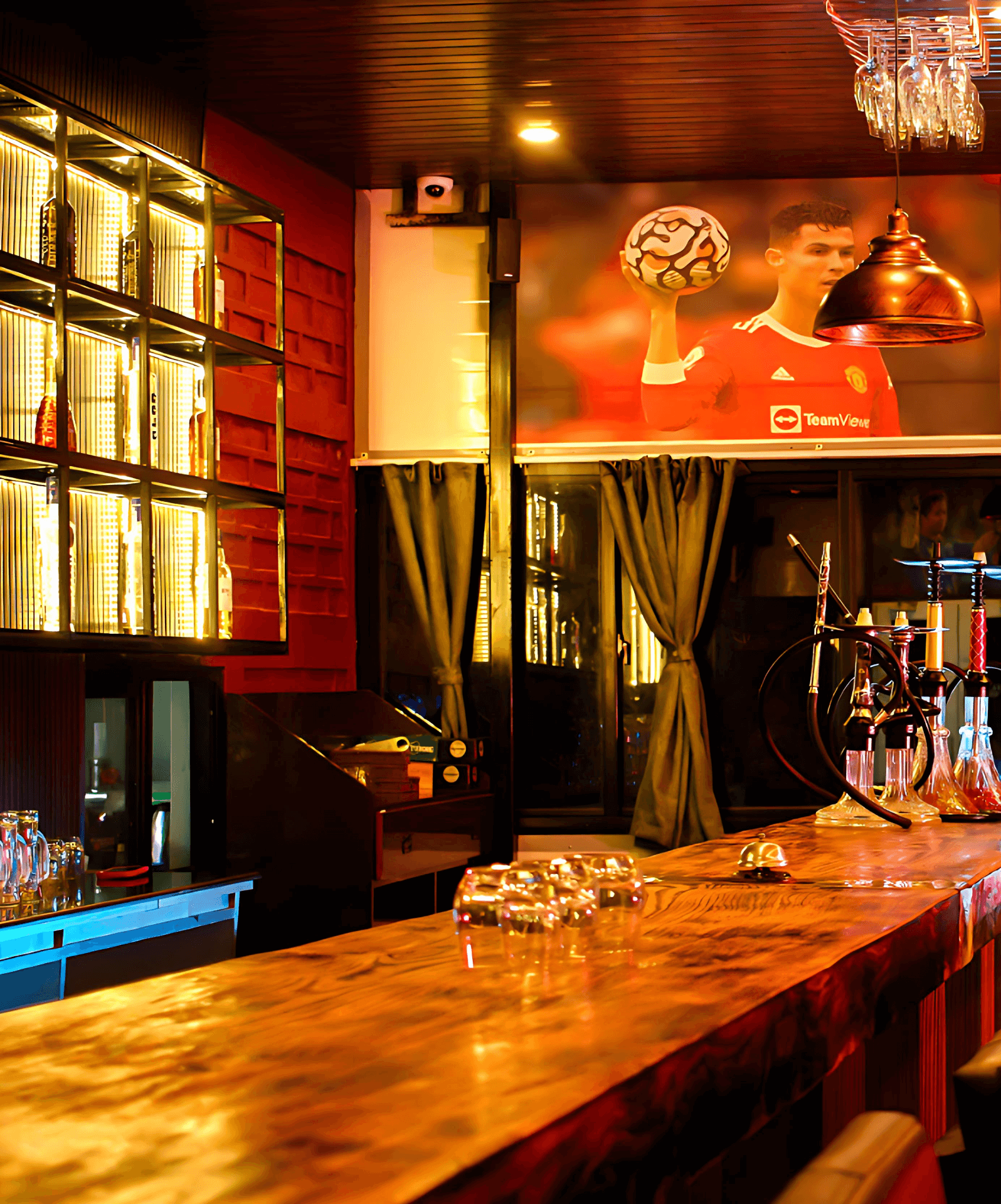 bar at Tourist Land Resort with cocktails and ambient evening lighting